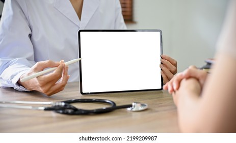 Close-up Image, A Professional Female Doctor Showing Something On Tablet Screen To Her Patient During The Meeting. Tablet White Screen Mockup