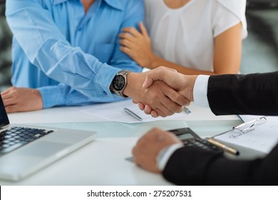 Close-up Image Of Real Estate Agent And His Client Shaking Hands