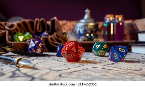 Close-up image of a red 20-sided role-playing gaming on brown paper within the background a leather dice bag and magic potions