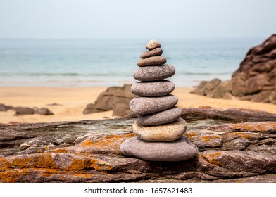 Close-up image of a rocks tower on a rocky beach in Brittany, France.