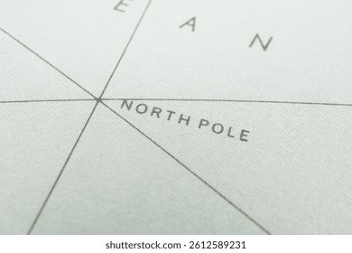 Close-up image of a section from an Antarctic map, featuring the North Pole label and grid lines for latitude and longitude The terrain is depicted using shading or contour lines