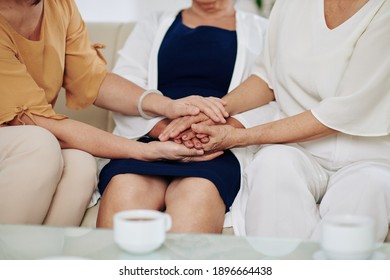 Close-up Image Of Senior Women Touching Hands To Support Each Other Through Difficult Time