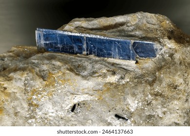 A close-up image showcasing the background texture of Kyanite, a typically blue aluminosilicate mineral known for its blade-like crystal structure, often used in ceramics and jewelry