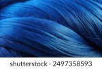 A close-up image showing the texture and details of a single electric blue hair strand.