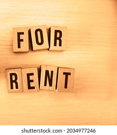 Close-up Image  Of Small House Model On Wooden Blocks With Rent Guarantee Text Over Table. Top View. Empty Copy Space.