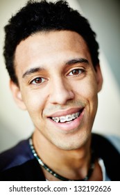 Close-up Image Of A Smiling Young Man With Braces