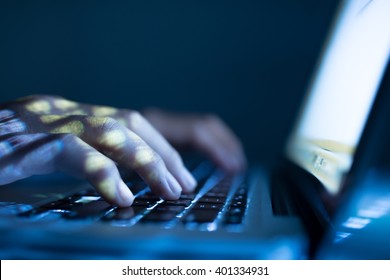 Close-up image of software engineer typing on laptop