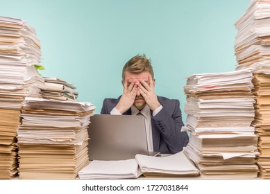 Close-up image of a stressful businessman tired from his work on the foreground - image
