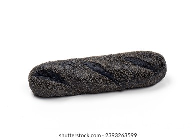 Close-up image of a sub roll naturally colored with activated charcoal sprinkled with poppy seeds, isolated on white background