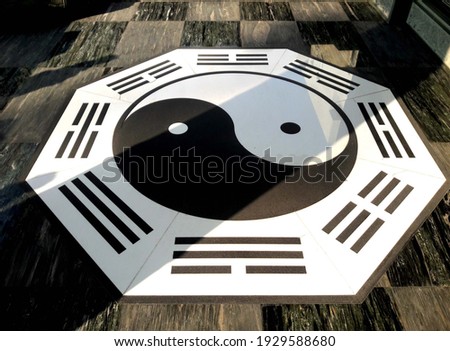 A close-up of the image of Tai Chi patterns in a Taiwanese temple in the sunset, exorcism on the floor
