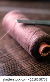 closeup image of thread with scissors