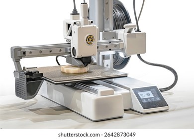 Close-up image of a white, high-precision CNC milling machine Sturdy construction with large table, digital interface screen, buttons, dials, cables organized in the background, bright lighting Wor
