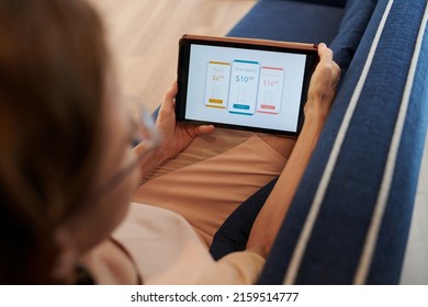 Close-up Image Of Woman Choosing Streaming Service Subscription Plan On Tablet Computer