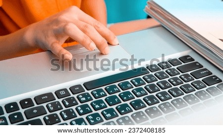 closeup image of Woman using a labtop computer background