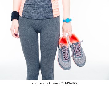 Closeup Image Of A Woman`s Hands Holding Sneakers