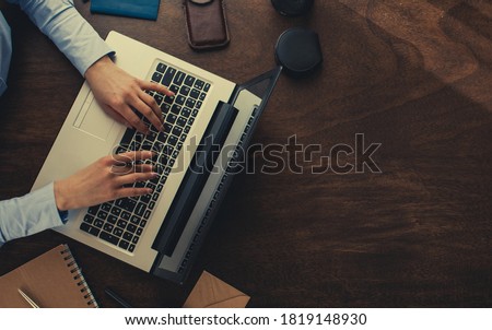 Closeup image of a woman's hands working and typing on laptop keyboard. Bussiness concept. 