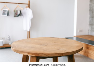 Closeup image of a wooden table and clothes rank in minimalist house - Powered by Shutterstock