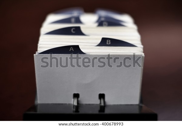 Closeup of index cards for business\
school or home organization organize names\
information