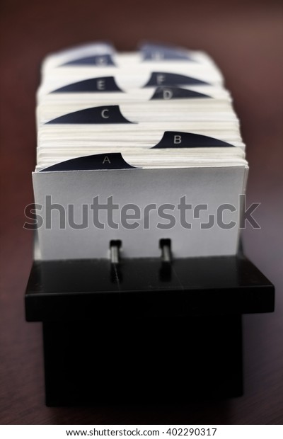 Closeup of index cards for business\
school or home organization organize names\
information