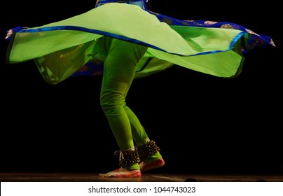   Closeup of Indian Kathak style female dancer with costume and bells tied to legs,a tradition                              
