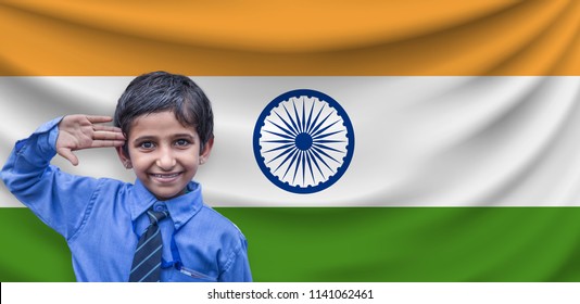 Close-up Of A Indian Kid Saluting In Front Of The Indian Flag