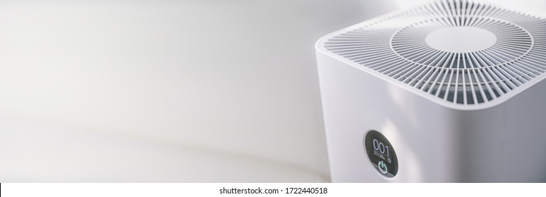 Closeup Of An Indoor Air Purifier In The Room Is Very Safe And Clean To Breathe While Dust Air Pollution Situation Outside Is Really Bad. Protect PM 2.5 Dust And Air Pollution Concept