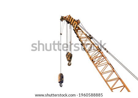 Close-up industrial big crane with steel hook for work on construction building outdoor site, isolated on white background 