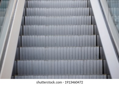 Close-up. Infrastructure at the airport. Metal escalator steps - Powered by Shutterstock