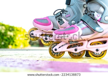 Woman in roller blades in skate park