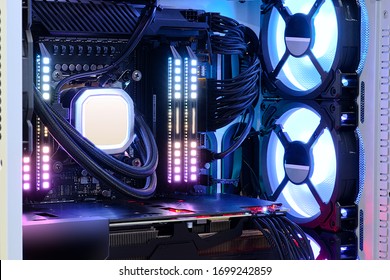 Close-up And Inside High Performance Desktop PC And Cooling System On CPU Socket With Multicolored LED RGB Light Show Status On Working, Interior On Computer PC Case And DIY, Technology Background