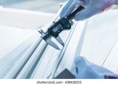 Closeup Of Inspector Checking Finished Pieces Of Aluminium Alloy By Using Vernier Caliper.