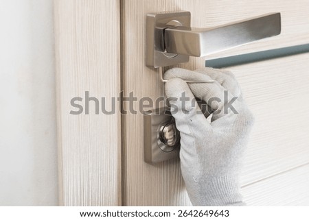 close-up of interior door lock handle installation