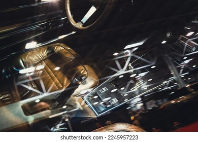 closeup interior view through the side window of vintage car classic design with brown leather seats and chrome ornaments - Powered by Shutterstock