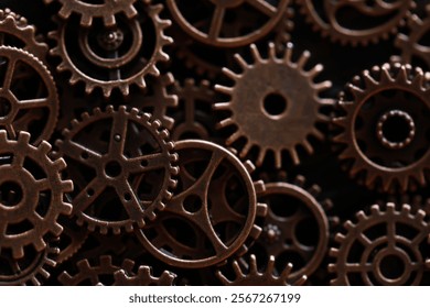 Close-up of Interlocking Antique Bronze Gears and Cogs in Industrial Machinery