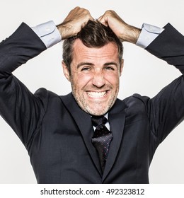 Closeup Of Irritated Young Business Man Pulling His Hair Out, Having A Burnout At Work, Suffering From Frustration And Tension, Isolated, White Background