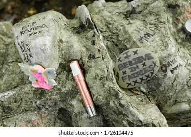 Closeup Of Isle Of Man Fairy Bridge Wall With Memorabilia And Wishes For The Fairies