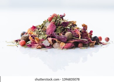 Close-up Of Italian Spices Blend With Rose On White Background