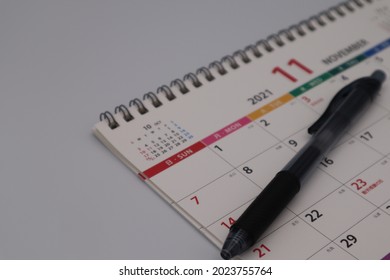 Close-up of Japanese calendar and ballpoint pen.
translation:Day,Red mouth,Tomobiki,Month,lucky day,First win,Predecessor,unlucky day,fire,Predecessor,Labor Thanksgiving Day,unlucky day,water. - Shutterstock ID 2023755764