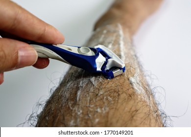 
Close-up Of A Japanese Man Shaving His Legs