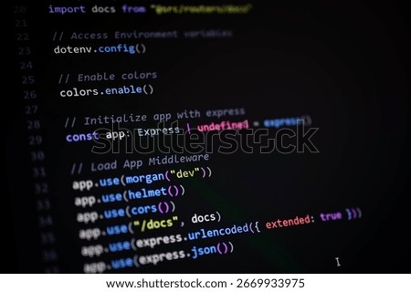 Close-up of JavaScript backend code showing Express app initialization with middleware configuration including CORS, Helmet, Morgan, and JSON parsing.