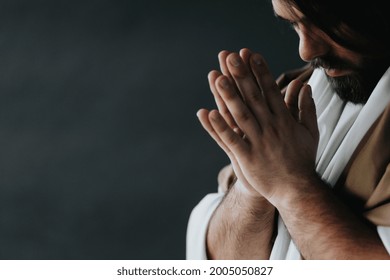 Close-up of Jesus Christ with his hands together asking for a blessing - Shutterstock ID 2005050827