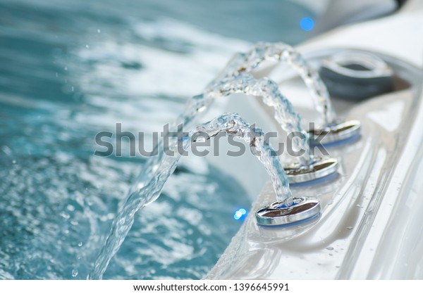 closeup of jet of water in\
swirl bath