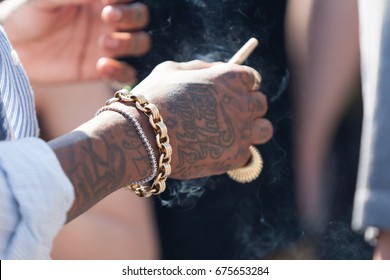 wiz khalifa hand sign