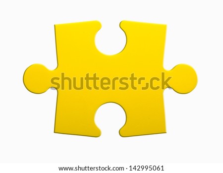 Closeup of jigsaw puzzle piece isolated on white