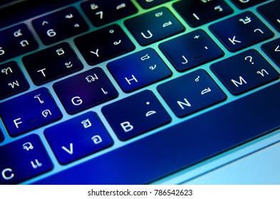 closeup keyboard touchbar colorful light with thai english Language , laptop , notebook