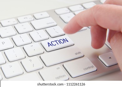 Close-up of a keyboard with the word "Action". Business concept.