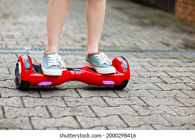 Close-up Of Kid Boy On Hover Board. Child Driving Modern Balance Hoverboard. Excercise And Sports For Children, Outdoor Activity For Young Kids.