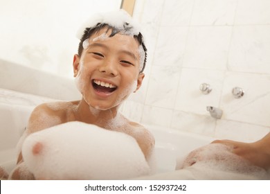 Close-up Of Kid In Bubble Bath