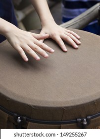 Closeup Of Kid Hands Playing Bongo