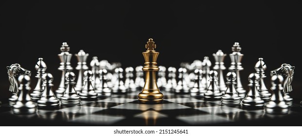 Close-up king chess standing on chessboard concepts of leader teamwork or volunteer or challenge of business team or wining and leadership strategy and organization risk management or team player.